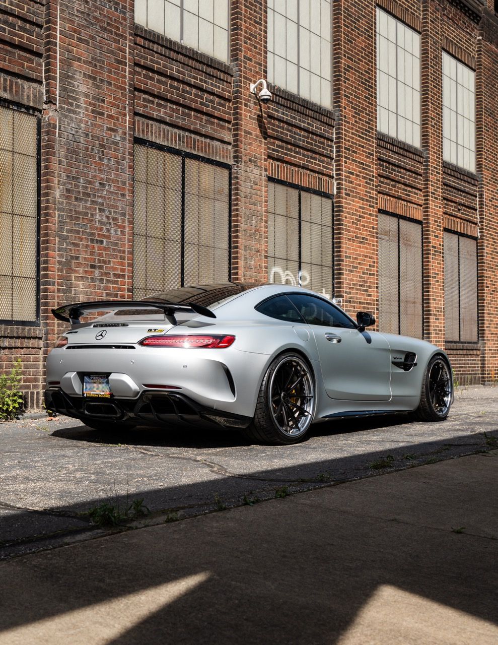 Mercedes-Benz AMG GTR with Motivo Forged CS-N custom wheels in frozen black face and gloss polished clear lip rear side view