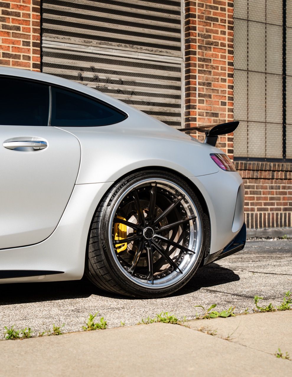 Mercedes-Benz AMG GTR with Motivo Forged CS-N custom wheels in frozen black face and gloss polished clear lip rear half side view