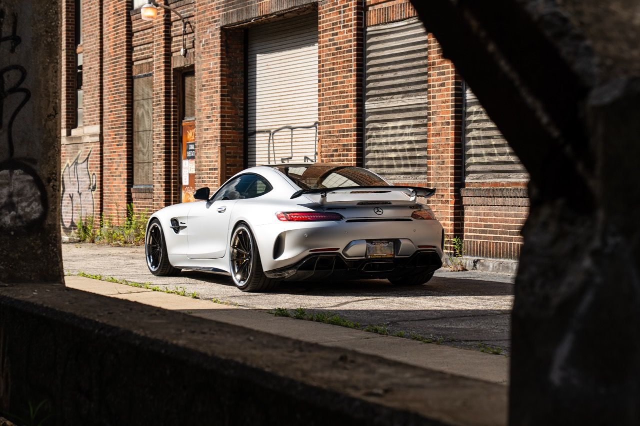 Mercedes-Benz AMG GTR with Motivo Forged CS-N custom wheels in frozen black face and gloss polished clear lip rear side view