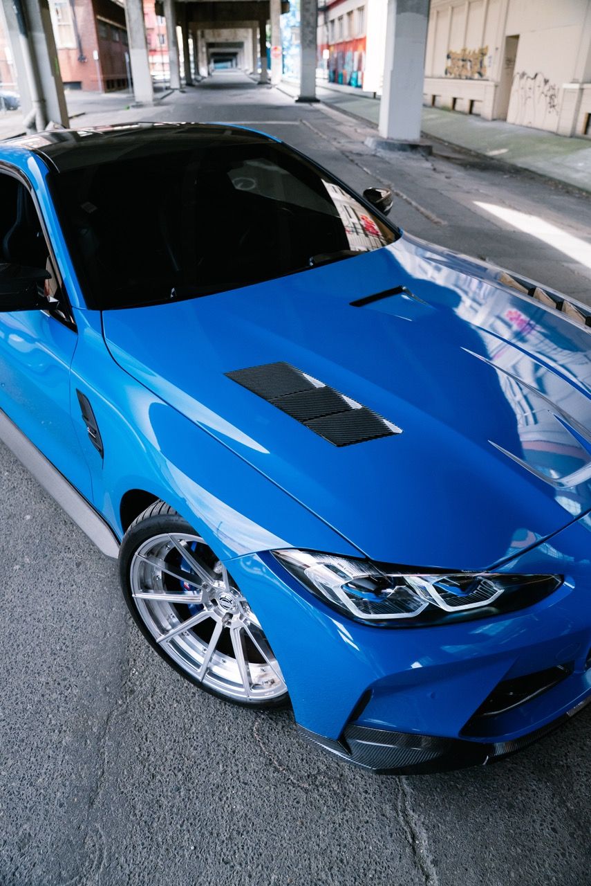 BMW M4 with Motivo Forged CS-U custom wheels in gloss polished clear face and brushed clear barrel front corner view