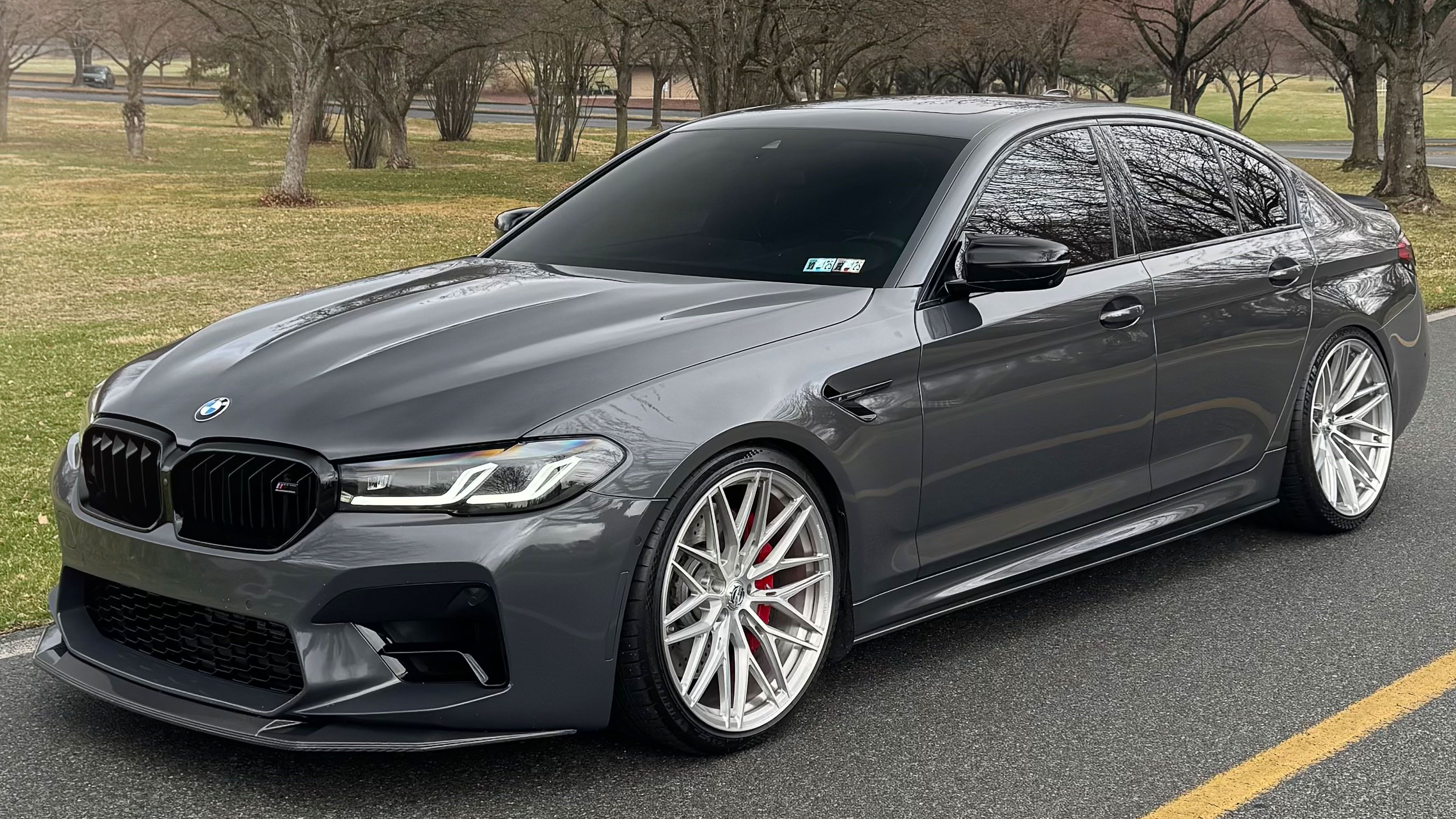 F90 BMW M5 LCI with Motivo Forged MB-F custom wheels in gloss brushed clear finish front side view